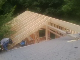 Framing a new roof addition that ties into an existing shingle roof in Gambier